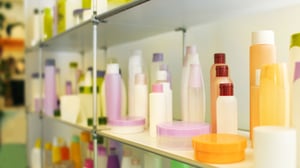 Stand with Cosmetic Products in Retail Shop