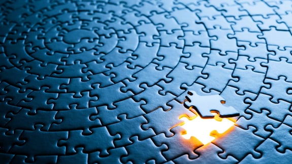 circular jigsaw puzzle representing collaboration