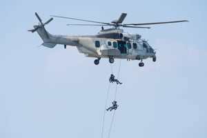special-forces-show-with-soldier-pilot-jump-from-helicopter-with-blue-sky