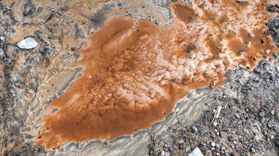 oxidized residue from ore, rust, and dire in a mining operation